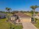 Beautiful home boasts mature landscaping, a brick driveway, and a well-maintained lawn at 13128 Se 97Th Terrace Rd, Summerfield, FL 34491