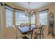 Formal dining area with elegant chandelier and ample natural light at 13128 Se 97Th Terrace Rd, Summerfield, FL 34491