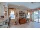 Cozy dining area with a hutch and ample natural light from the windows at 13128 Se 97Th Terrace Rd, Summerfield, FL 34491