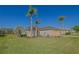 Attractive single-story house with beautiful landscaping and a well-maintained lawn at 13128 Se 97Th Terrace Rd, Summerfield, FL 34491