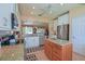 Well-lit kitchen featuring stainless steel appliances, granite countertops, and a convenient center island at 13128 Se 97Th Terrace Rd, Summerfield, FL 34491