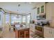 Well-lit kitchen with stainless steel appliances and a kitchen island at 13128 Se 97Th Terrace Rd, Summerfield, FL 34491