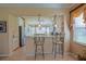 Kitchen with stainless steel appliances and bar seating at 13128 Se 97Th Terrace Rd, Summerfield, FL 34491