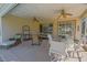 Inviting covered lanai offers a lovely setting for outdoor gatherings at 13128 Se 97Th Terrace Rd, Summerfield, FL 34491