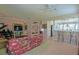 Spacious living room flows into the kitchen, featuring a grand piano at 13128 Se 97Th Terrace Rd, Summerfield, FL 34491