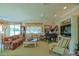 Elegant living room featuring a grand piano and comfortable seating arrangement at 13128 Se 97Th Terrace Rd, Summerfield, FL 34491