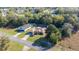 Aerial view of two single-story homes with mature trees and landscaping in a well-maintained neighborhood at 14059 Sw 47Th Ave, Ocala, FL 34473