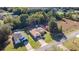 Aerial view of two single-story homes with mature trees and landscaping in a well-maintained neighborhood at 14059 Sw 47Th Ave, Ocala, FL 34473