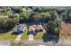Aerial view of two single-story homes with mature trees and landscaping in a well-maintained neighborhood at 14059 Sw 47Th Ave, Ocala, FL 34473