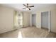 A bedroom with plush carpeting, a window and closet at 14059 Sw 47Th Ave, Ocala, FL 34473