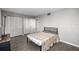 A bedroom featuring sleek wood floors, a neutral color scheme, and ample closet space at 14059 Sw 47Th Ave, Ocala, FL 34473