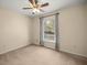 A bedroom with plush carpeting, natural lighting, and neutral colored walls at 14059 Sw 47Th Ave, Ocala, FL 34473