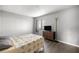 This bedroom boasts wood floors, a large window, and a full dresser at 14059 Sw 47Th Ave, Ocala, FL 34473