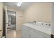 Convenient laundry room with modern washer and dryer, providing ease for daily chores at 14059 Sw 47Th Ave, Ocala, FL 34473
