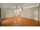 Expansive living room featuring laminate flooring and a classic ceiling fan at 14059 Sw 47Th Ave, Ocala, FL 34473