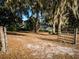 Charming home partially obscured by mature trees at 14540 Ne 250Th Ave, Fort Mc Coy, FL 32134