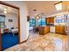 Bright kitchen with wood cabinets, tile floors, and a cozy breakfast nook overlooking the landscaped yard at 14540 Ne 250Th Ave, Fort Mc Coy, FL 32134