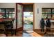 Covered porch view showcasing outdoor seating, a lake view, and a relaxing atmosphere at 14540 Ne 250Th Ave, Fort Mc Coy, FL 32134