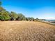 Expansive waterfront property featuring a gently sloping lawn and breathtaking views of the water at 14540 Ne 250Th Ave, Fort Mc Coy, FL 32134
