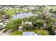 Aerial view of a neighborhood homes surrounded by trees and greenery at 1628 Se 29Th Ter, Ocala, FL 34471