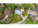 Aerial view of a home with a pool and lush landscaping at 1628 Se 29Th Ter, Ocala, FL 34471