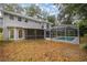 View of home's backyard with screened-in pool, and exterior of home at 1628 Se 29Th Ter, Ocala, FL 34471