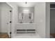 Modern bathroom features a dual sink vanity with white cabinets and marble countertops at 1628 Se 29Th Ter, Ocala, FL 34471