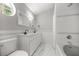Bright bathroom featuring double sinks, tile flooring, and a soaking tub with shower combo at 1628 Se 29Th Ter, Ocala, FL 34471