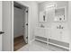 Bright bathroom features double sinks, white vanity, and marble flooring in a modern design at 1628 Se 29Th Ter, Ocala, FL 34471