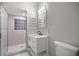 Modern bathroom with a glass shower, bright vanity and a tiled floor at 1628 Se 29Th Ter, Ocala, FL 34471
