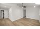 Bedroom featuring wood-look floors, a ceiling fan, and two closets at 1628 Se 29Th Ter, Ocala, FL 34471