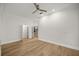 Large bedroom with hardwood floors and white trim has open doorways to other areas at 1628 Se 29Th Ter, Ocala, FL 34471