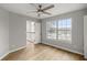 Bedroom with wood floors, large window overlooking outdoor pond at 1628 Se 29Th Ter, Ocala, FL 34471