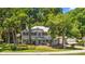 Charming two-story home with a covered porch and mature trees, providing ample shade and curb appeal at 1628 Se 29Th Ter, Ocala, FL 34471
