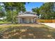 A charming gray two-story home with a covered front porch and attached carport at 1628 Se 29Th Ter, Ocala, FL 34471