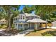 Elegant two-story home with a welcoming porch and detailed architectural features at 1628 Se 29Th Ter, Ocala, FL 34471