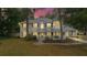 Charming two-story home featuring a welcoming front porch and a unique turret design at 1628 Se 29Th Ter, Ocala, FL 34471
