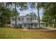 Charming two-story home featuring a welcoming front porch and a unique turret design at 1628 Se 29Th Ter, Ocala, FL 34471