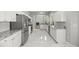 Modern kitchen featuring marble countertops, stainless steel appliances, and ample cabinet space at 1628 Se 29Th Ter, Ocala, FL 34471