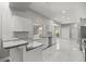 Modern kitchen features marble countertops, stainless steel appliances, and ample cabinet space at 1628 Se 29Th Ter, Ocala, FL 34471