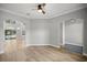 An elegant living room featuring wood flooring, recessed lighting, and a ceiling fan at 1628 Se 29Th Ter, Ocala, FL 34471