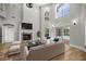 Bright living room featuring wood floors, high ceilings, fireplace, and backyard access at 1628 Se 29Th Ter, Ocala, FL 34471