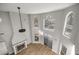 View of living area with high ceilings, large windows, and a traditional fireplace at 1628 Se 29Th Ter, Ocala, FL 34471