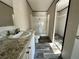 Bathroom with a modern vanity, granite countertop and walk-in shower at 1921 Nw 120Th Ave, Ocala, FL 34482