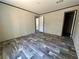 Spacious primary bedroom boasts modern floors and ample natural light at 1921 Nw 120Th Ave, Ocala, FL 34482