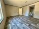 Generous bedroom featuring stylish flooring and an en-suite bathroom for added privacy at 1921 Nw 120Th Ave, Ocala, FL 34482
