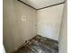 A dedicated laundry room area with durable flooring and essential utility connections at 1921 Nw 120Th Ave, Ocala, FL 34482