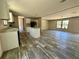 Open floor plan showcasing the living room and kitchen with a stylish center island at 1921 Nw 120Th Ave, Ocala, FL 34482