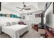 Comfortable bedroom with a tray ceiling, ceiling fan, and a window letting in natural light at 1956 Nw 50Th Cir, Ocala, FL 34482