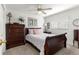 Cozy bedroom with classic wooden furniture, soft carpet, and natural light from the window at 1956 Nw 50Th Cir, Ocala, FL 34482